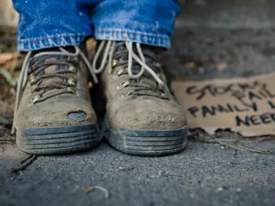 A closeup of a person's worn boats.