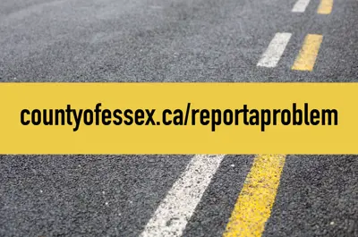 A yellow line over a road with yellow and white stripes and the words countyofessex.ca/reportaproblem
