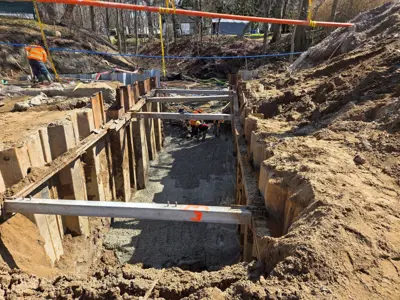 Crews work on the Lonsberry Drain culvert replacement project near Colchester