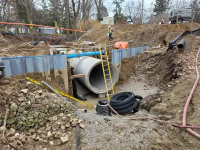 Crews work on the Lonsberry Drain culvert replacement project near Colchester
