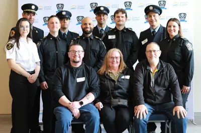 Brandon, Tammy and Bryan Brown at Survivor Day with the paramedics and firefighters who helped save Tammy's life.