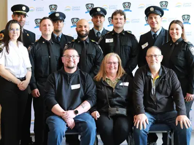 Brandon, Tammy and Bryan Brown at Survivor Day with the paramedics and firefighters who helped save Tammy's life.