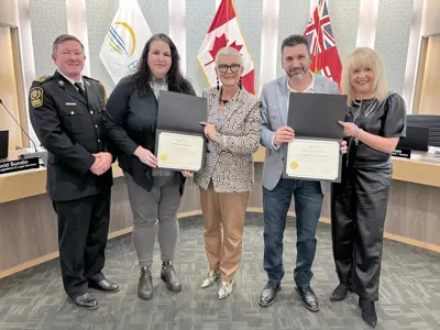 Essex-Windsor EMS Deputy Chief Ryan Lemay and Warden Hilda MacDonald presents certificates to representatives of Erie James Produce and the Leamington Regional Food Hub at the March 5, 2025, Essex County Council meeting.