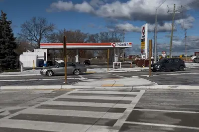 Traffic moves on the newly reopened section of County Road 42 in Tecumseh.