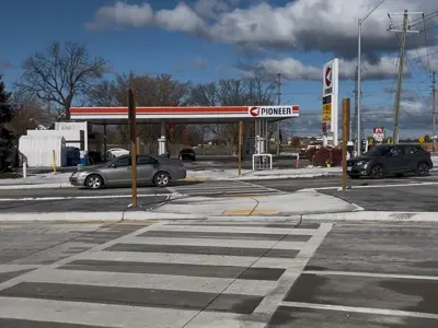 Traffic moves on the newly reopened section of County Road 42 in Tecumseh.