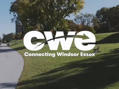 Connecting Windsor-Essex logo atop greenery