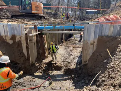 Crews work on the Lonsberry Drain culvert replacement project near Colchester
