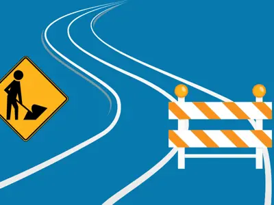 Construction icons and the outline of a curving road against a blue background