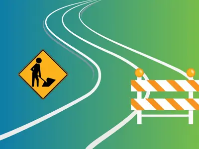 A road with construction signs.