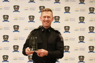 Essex-Windsor EMS Paramedic Gerry Seguin holds his award from Trillium Gift of Life