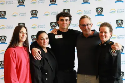 Jack Luck with this parents and sister, and paramedic Dawn Hodges at Survivor Day.