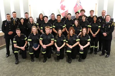 Paramedics welcomed at a commencement ceremony on May 30, 2025, with the chief and deputy chiefs.