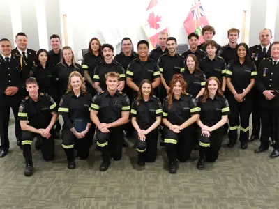 Paramedics welcomed at a commencement ceremony on May 30, 2025, with the chief and deputy chiefs.