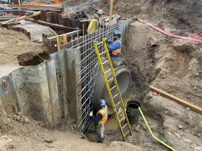 Crews work on the Lonsberry Drain culvert replacement project near Colchester