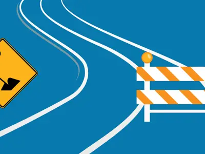 A road with construction signs.